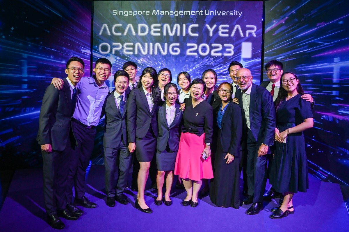 SMU Chairman Mr Piyush Gupta (front row, 2nd from right) with SMU President Prof Lily Kong (front row, 4th from right) with students at the Academic Year Opening..