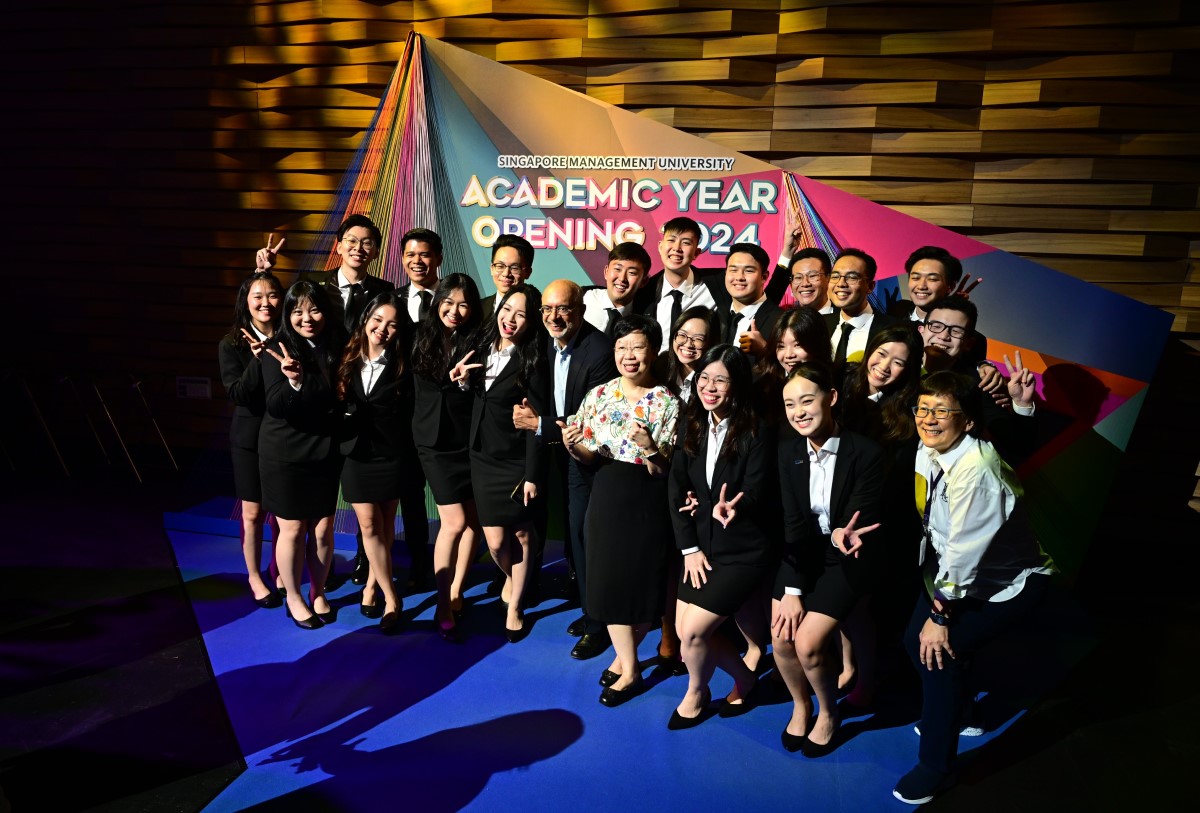 SMU Dean of Students Prof Paulin Straughn (first row, first from right), SMU President Prof Lily Kong (first row, 4th from right) and SMU Chairman Mr Piyush Gupta (first row, 5th from right) with members of the SMU Student Association at the Academic Year Opening 2024.