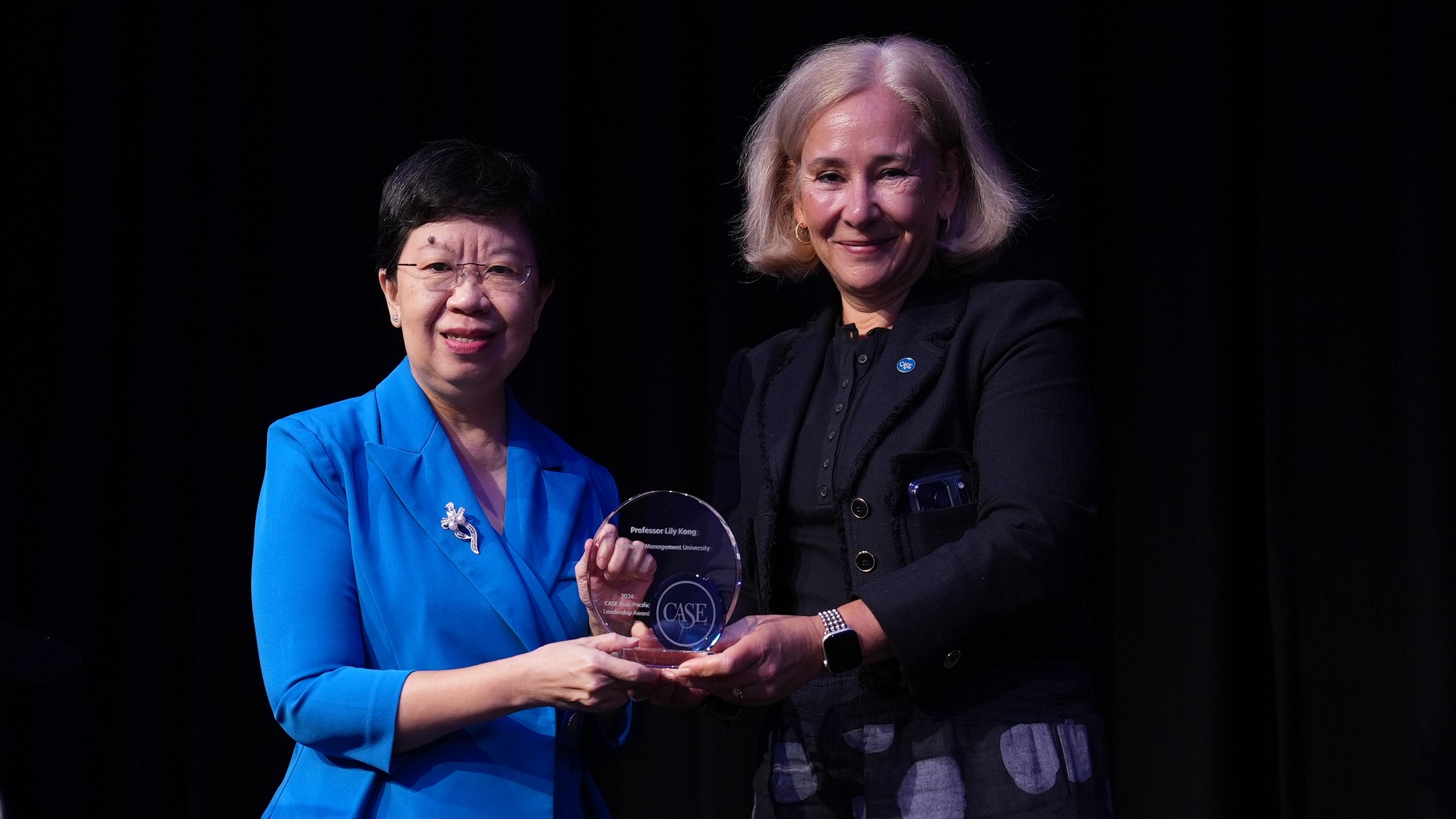 CASE President and CEO Sue Cunningham presenting the 2026 CASE Asia-Pacific Leadership Award to SMU President Professor Lily Kong in Brisbane.