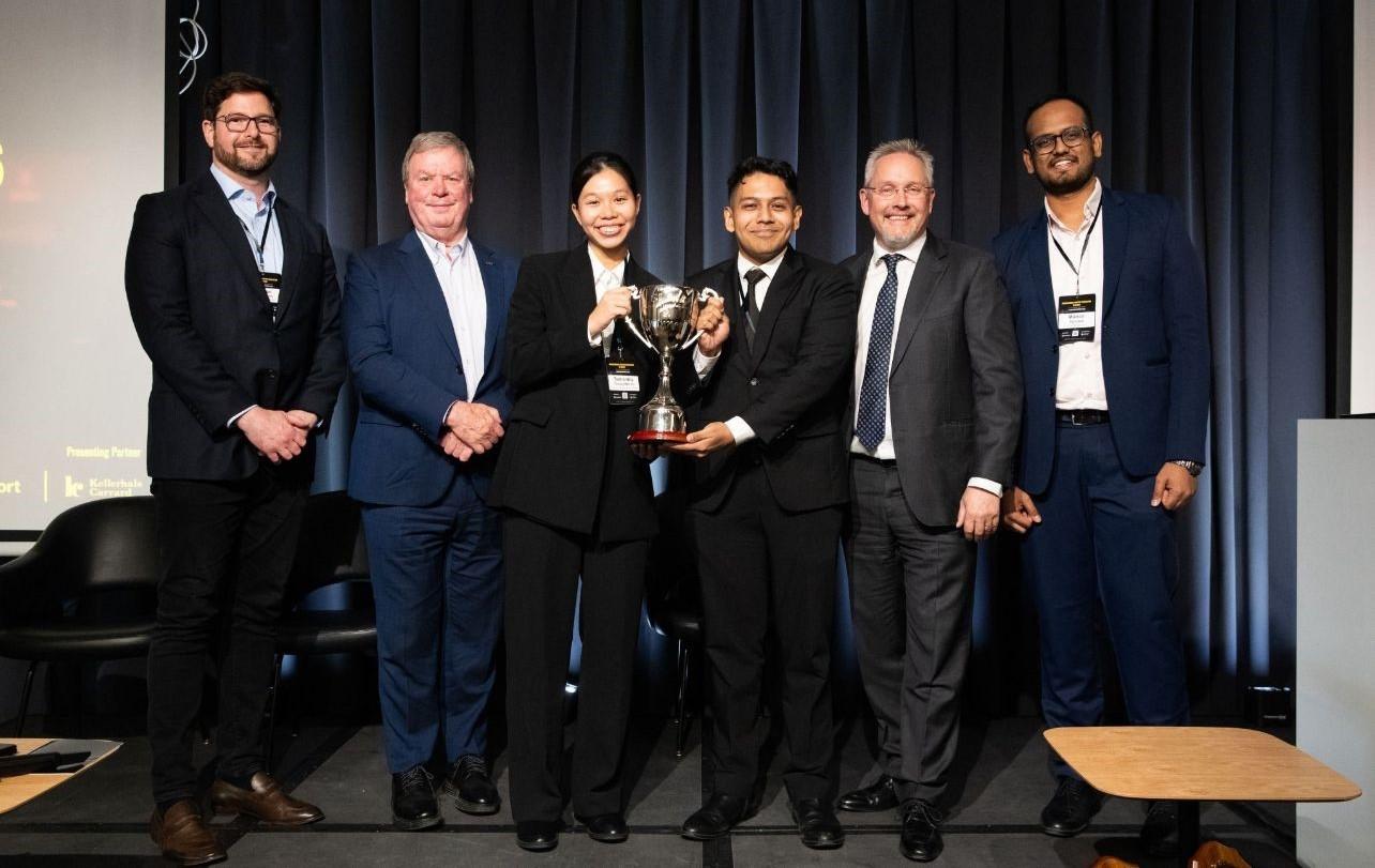 SMU undergraduates Samantha Chong Wei En and Ameerul Putra Bin Abdul Wahab (both centre) receiving their championship trophy from (left to right) Sean Cottrell (CEO & Co-founder of LawInSport), Michael Lenard OLY (President of the International Council of Arbitration for Sport, ICAS), Matthieu Reeb (Director General of CAS) and Manan Agrawal (Director of SLAM). [Photo credit: LawInSport]