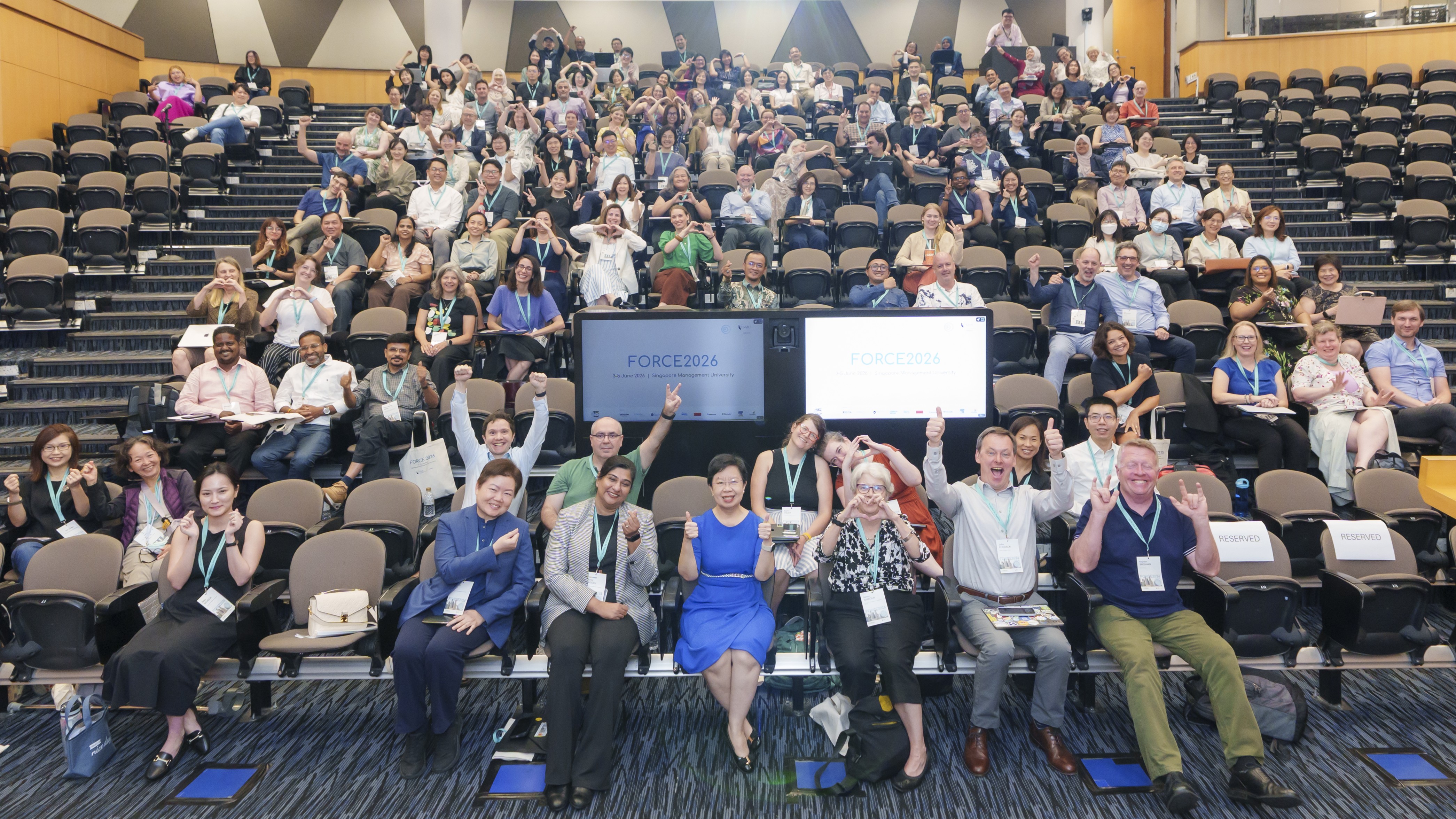 Conference speakers and participants gather for a group photo on day one of FORCE2026