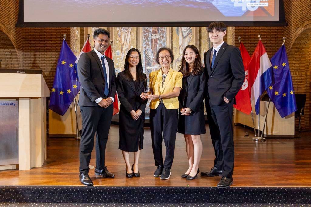 The winning team with faculty advisor, Dr Ma Kheng Min and the trophy.