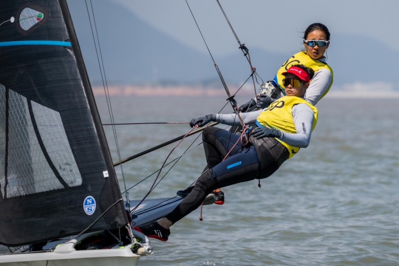 SMU alumna Kimberly Lim (top) won Bronze with her teammate Cecilia Low.