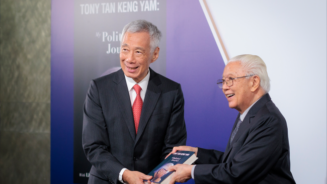 Dr Tony Tan presenting a copy of his book to PM Lee Hsien Loong at the book launch.