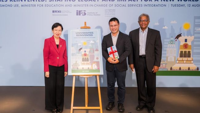 Minister for Education Desmond Lee (centre), SMU President Professor Lily Kong (left) and IPS Director Mr Janadas Devan (right) unveiling the cover of Universities Reinvented: Shaping Legacy and Impact for a New World at the book launch on 12 August 2025. Minister for Education Desmond Lee (centre), SMU President Professor Lily Kong (left) and IPS Director Mr Janadas Devan (right) unveiling the cover of Universities Reinvented: Shaping Legacy and Impact for a New World at the book launch on 12 August 2025.