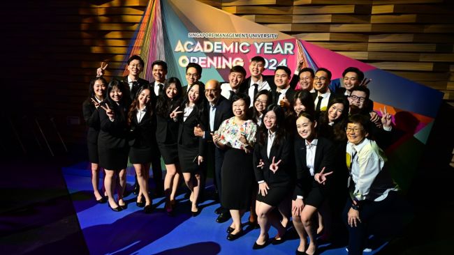 SMU Dean of Students Prof Paulin Straughn (first row, first from right), SMU President Prof Lily Kong (first row, 4th from right) and SMU Chairman Mr Piyush Gupta (first row, 5th from right) with members of the SMU Student Association at the Academic Year Opening 2024.