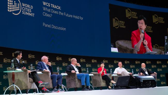 SMU President Prof Lily Kong (centre and on screen) at the World Cities Summit 2022, in a panel discussion on “What does the future hold for cities?”.