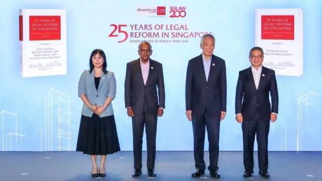 (L-R) SMU Prof Yip Man with Senior Minister K Shanmugam SC, Senior Minister Lee Hsien Loong and Minister Edwin Tong, at the book launch event (Photo credit: Ministry of Law)